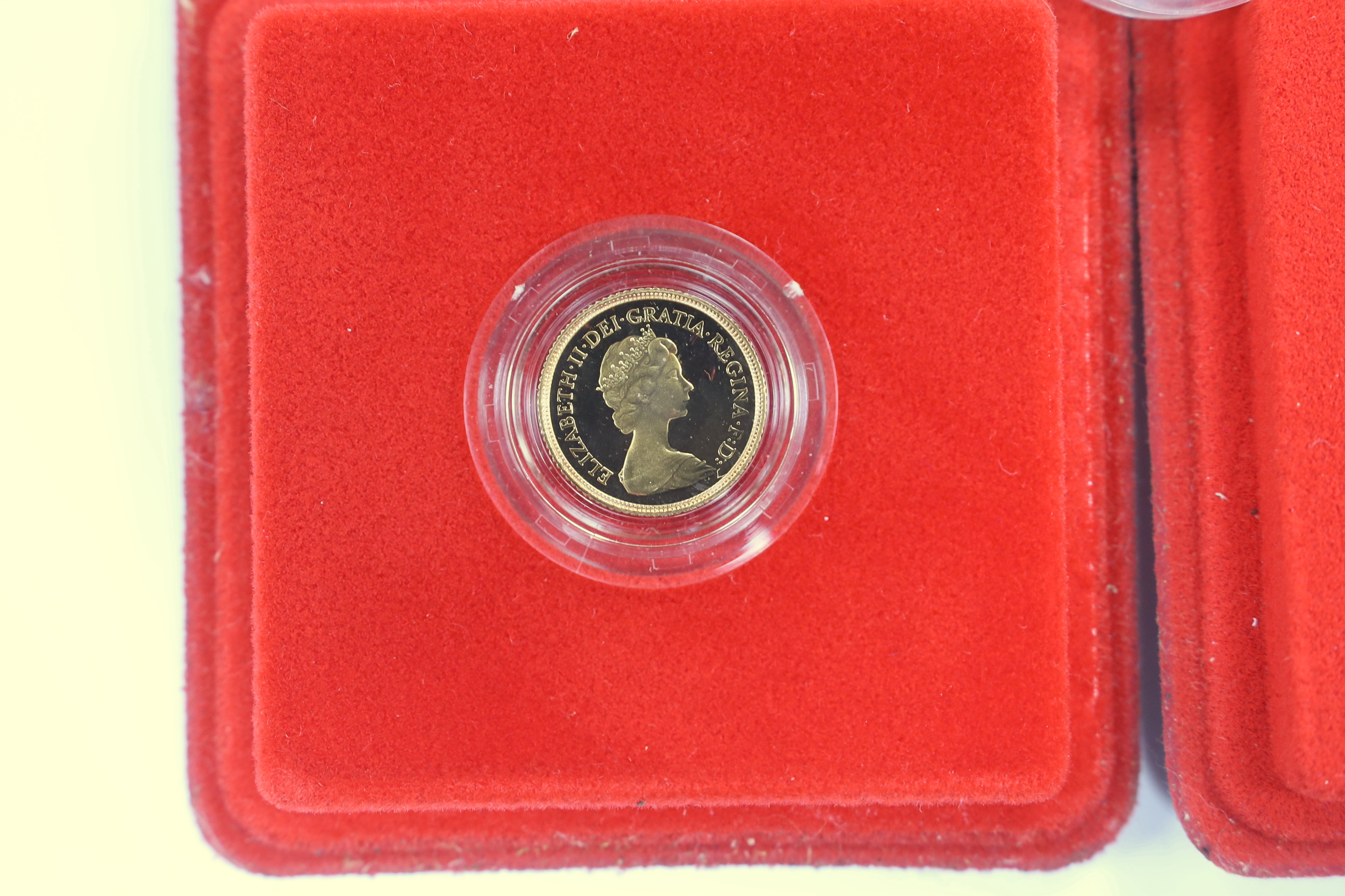British gold coins - Two Royal Mint QEII Gold Proof Half Sovereigns, both 1980, both with case of issue and another proof gold half sovereign, 1982, without case (3)